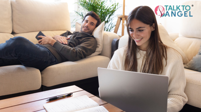 Busy couple attending online therapy session on laptop at home