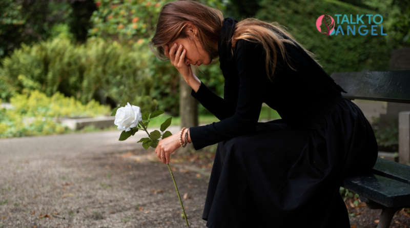 Person sitting alone feeling sad after loss, representing grief & depression