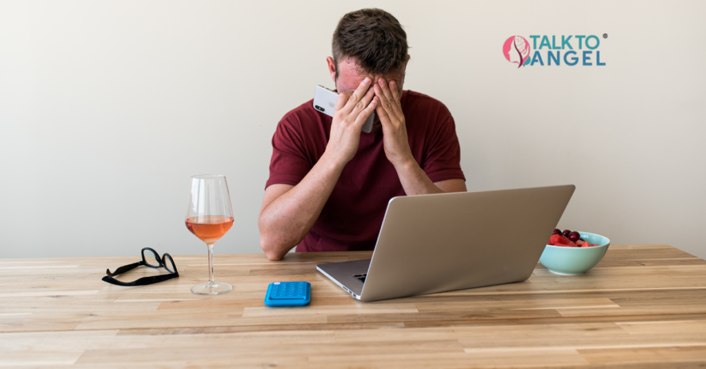 Overwhelmed person managing stress with online therapy support