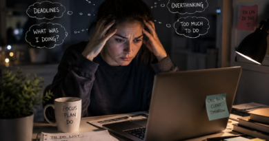 Adult with ADHD feeling mentally overwhelmed while working late on a laptop at home during an ADHD psychiatry consultation.