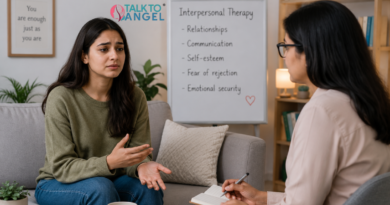 A woman in interpersonal therapy session discussing low self-esteem & fear of rejection with a therapist.