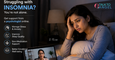 Woman struggling with insomnia while using online therapy support late at night.