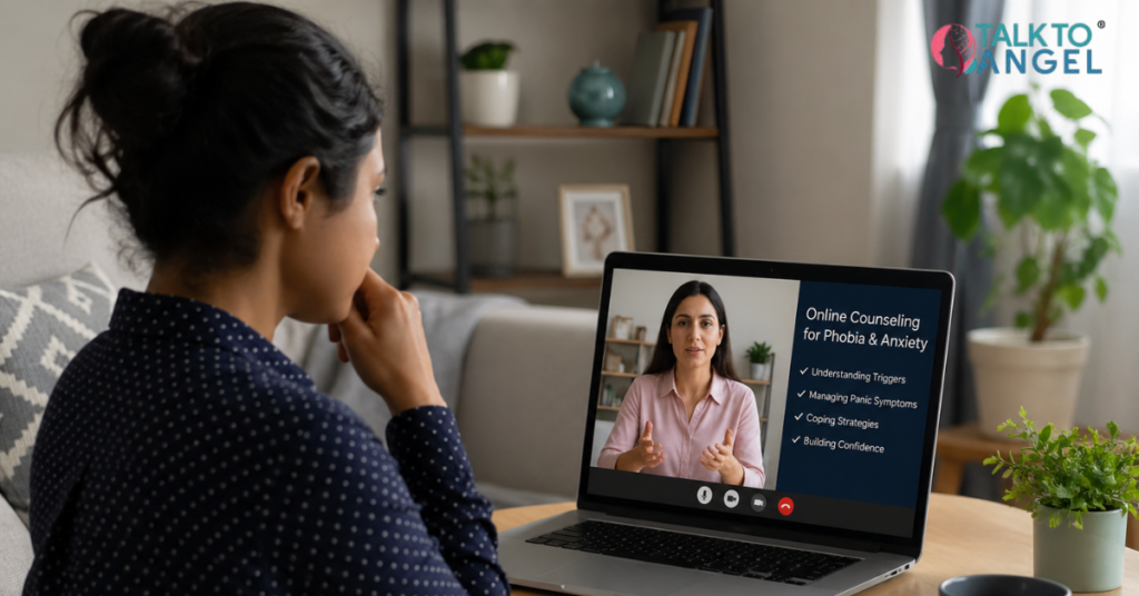 Person sitting at home using a laptop for online counselling to manage phobia anxiety