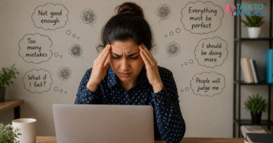 Person feeling stressed while working on laptop, struggling with perfectionism and OCD