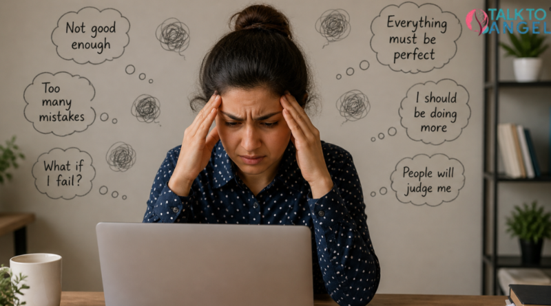 Person feeling stressed while working on laptop, struggling with perfectionism and OCD