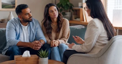 Couple discussing relationship problems with a counsellor for professional support and guidance.
