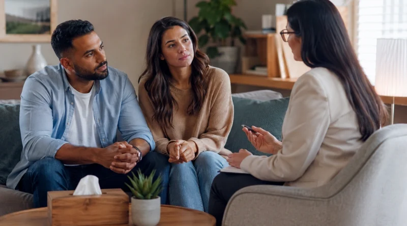 Couple discussing relationship problems with a counsellor for professional support and guidance.