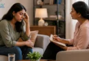 Depressed person talking with a therapist during an depression counselling session for emotional support.