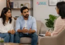 Couple discussing relationship concerns with a couples counselor during a supportive couples therapy session.