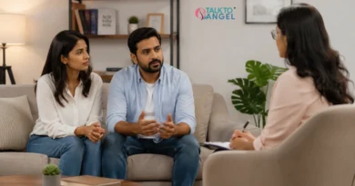 Couple discussing relationship concerns with a couples counselor during a supportive couples therapy session.