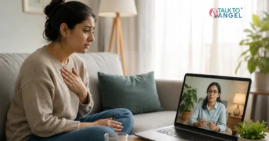 Person experiencing panic attack symptoms while seeking support through online therapy