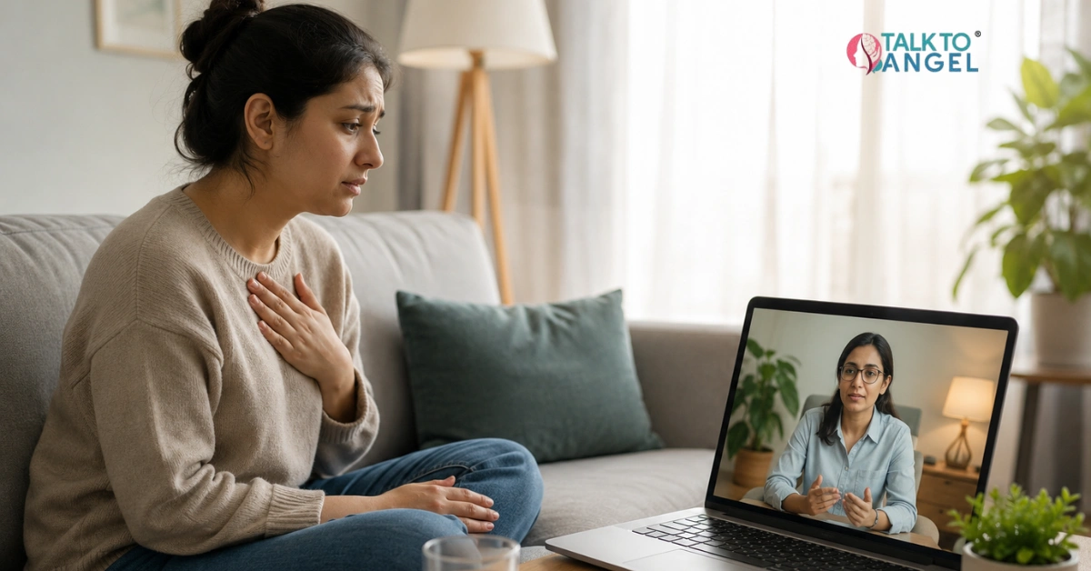 Person experiencing panic attack symptoms while seeking support through online therapy