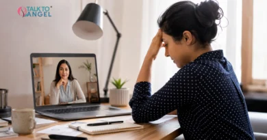 Professional counsellor helping an employee manage workplace anxiety during an online therapy session.