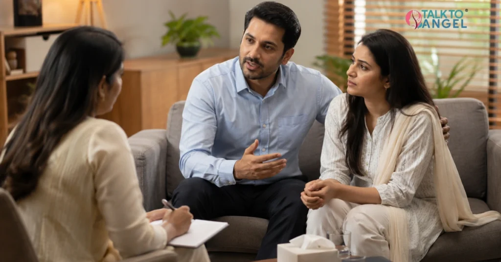 Couple discussing in-law conflicts with a Delhi marriage counsellor during a supportive therapy session.